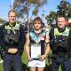Taylors Lake Swifts under-17s footballer Lachie Kenyon receives his Blue Ribbon Spirit of Football award from Stawell police officers Sergeant Richard Jane and First Constable Nathan Byrne. Picture supplied
